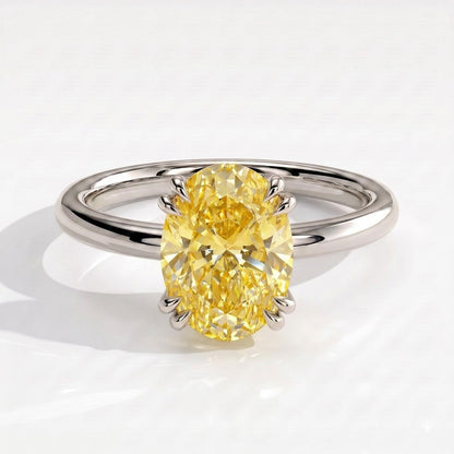 Fancy Vivid Yellow oval lab-grown diamond double claw engagement ring with hidden halo in 14K (585) white gold, front view 