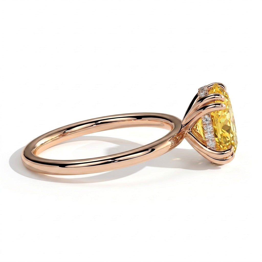 Fancy Vivid Yellow oval lab-grown diamond double claw engagement ring with hidden halo in 18K (750) rose gold, detail view of the double claws 