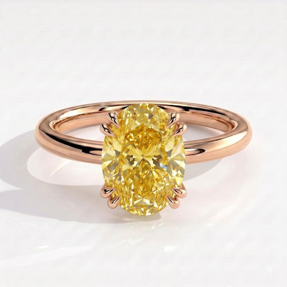 Fancy Vivid Yellow oval lab-grown diamond double claw engagement ring with hidden halo in 18K (750) rose gold, front view 