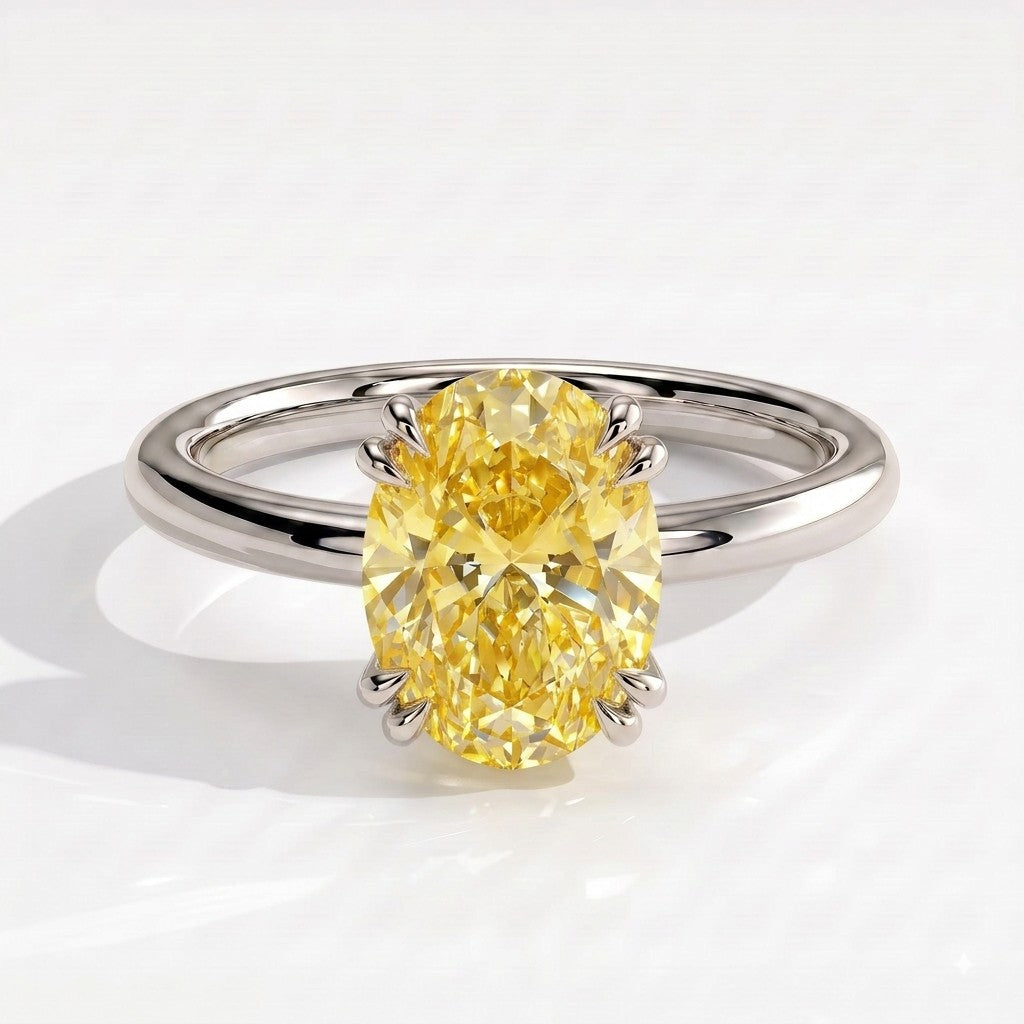 Fancy Vivid Yellow oval lab-grown diamond double claw engagement ring with hidden halo in 18K (750) white gold, front view 