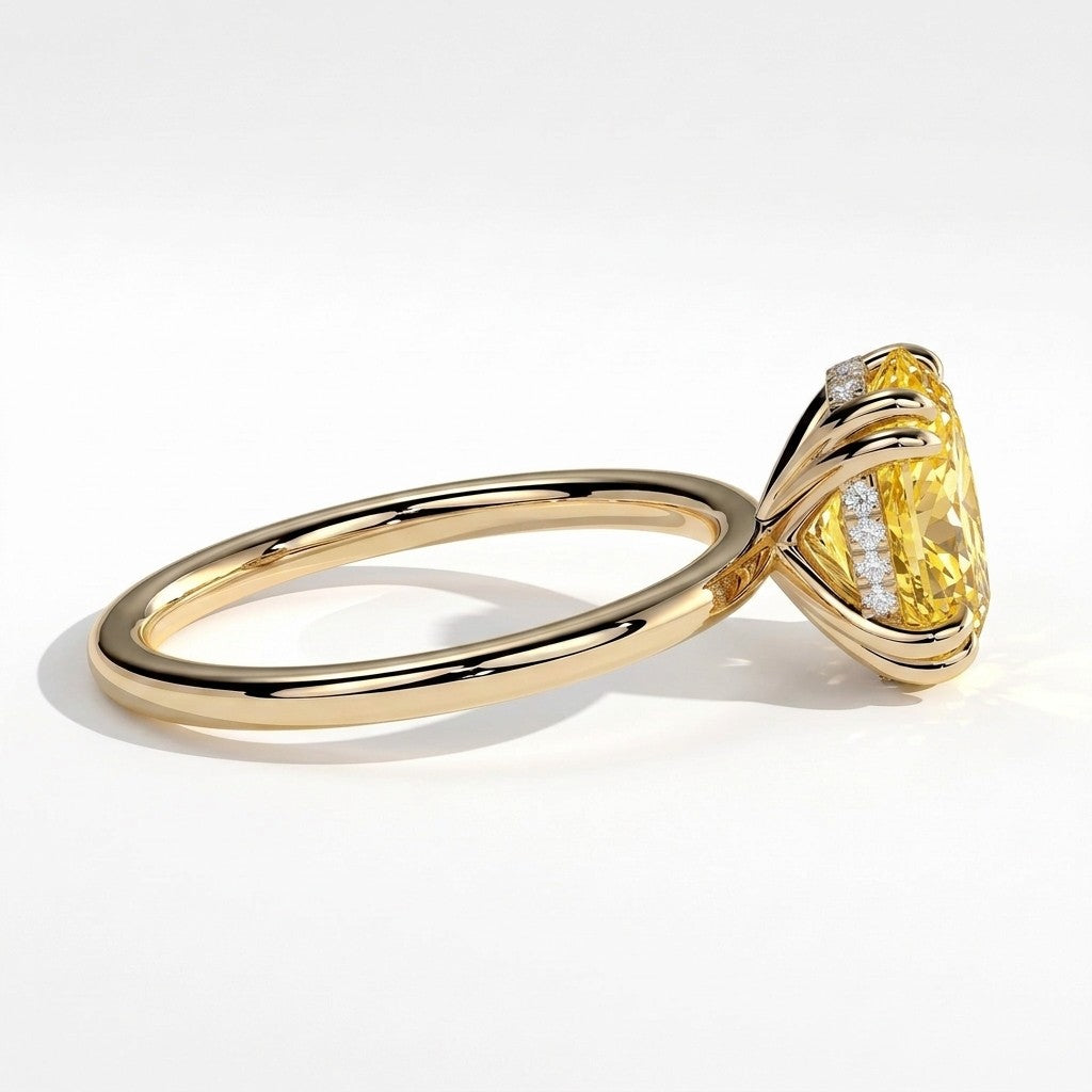 Fancy Vivid Yellow oval lab-grown diamond double claw engagement ring with hidden halo in 18K (750) yellow gold, detail view of the double claws 