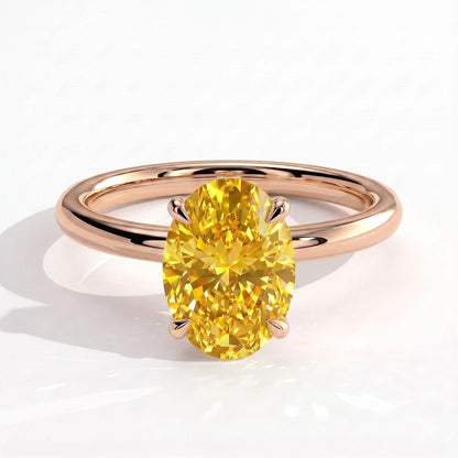 Fancy Vivid Yellow oval lab-grown diamond engagement ring with wrap-around hidden halo in 14K (585) rose gold, front view 