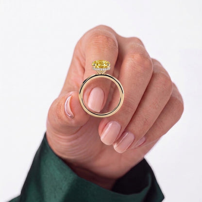 Fancy Vivid Yellow oval lab-grown diamond engagement ring with wrap-around hidden halo in 18K (750) white gold, studio view 