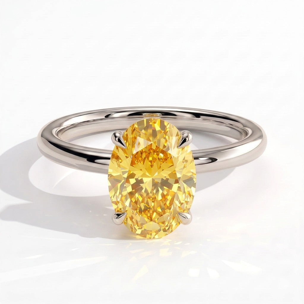 Fancy Vivid Yellow oval lab-grown diamond engagement ring with wrap-around hidden halo in 950 platinum, front view 