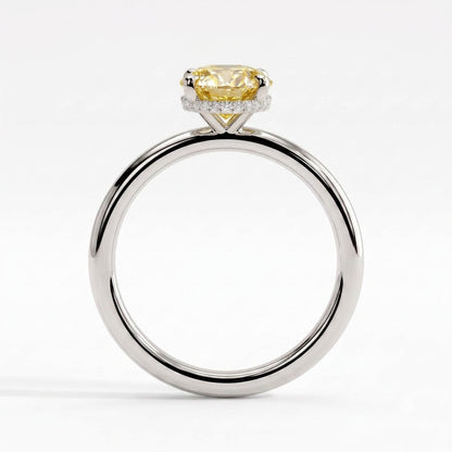 Fancy Vivid Yellow oval lab-grown diamond engagement ring with wrap-around hidden halo in 950 platinum, side profile showing the hidden halo 