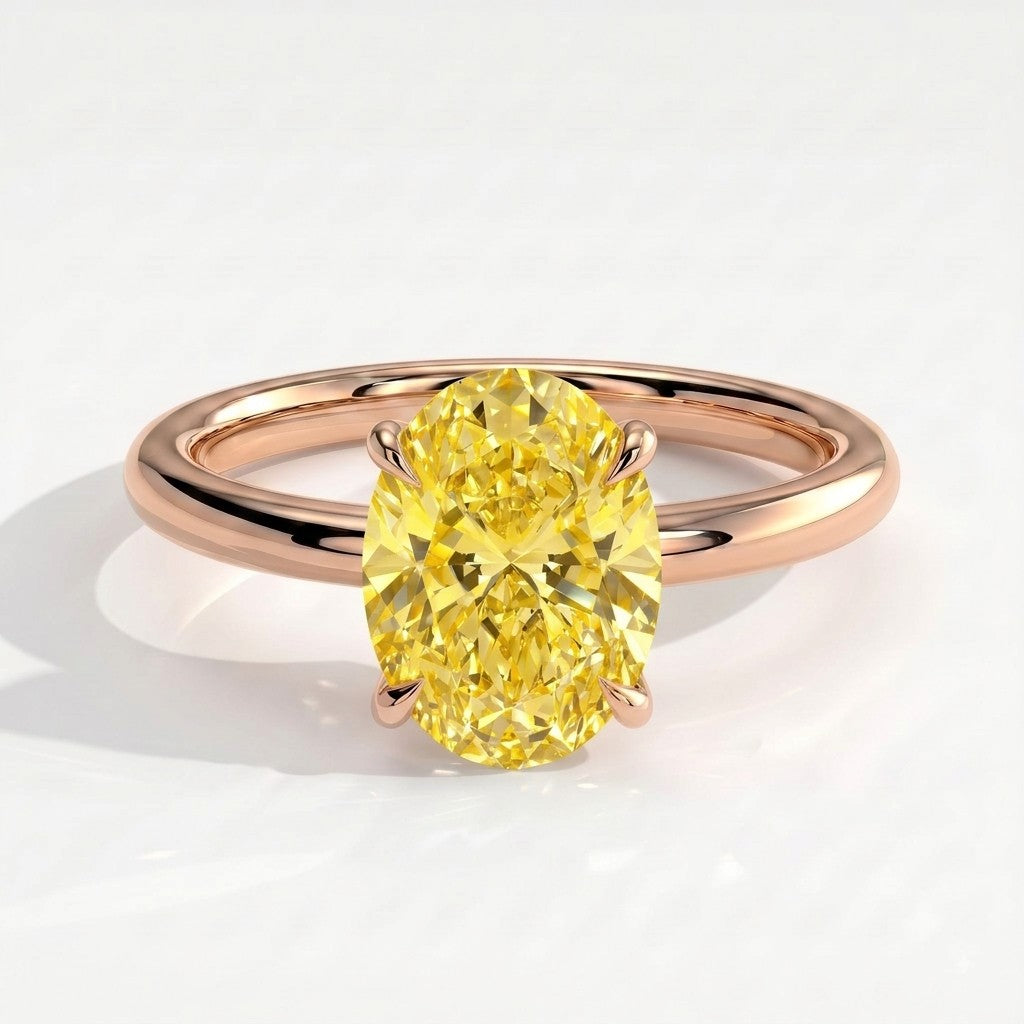 Fancy Vivid Yellow oval lab-grown diamond solitaire engagement ring in 14K (585) rose gold, front view 