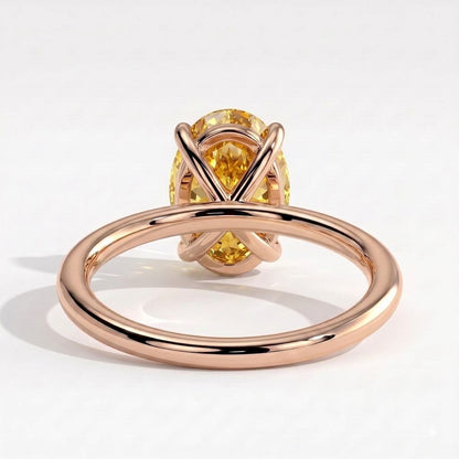 Fancy Vivid Yellow oval lab-grown diamond solitaire engagement ring in 14K (585) rose gold, on white background 