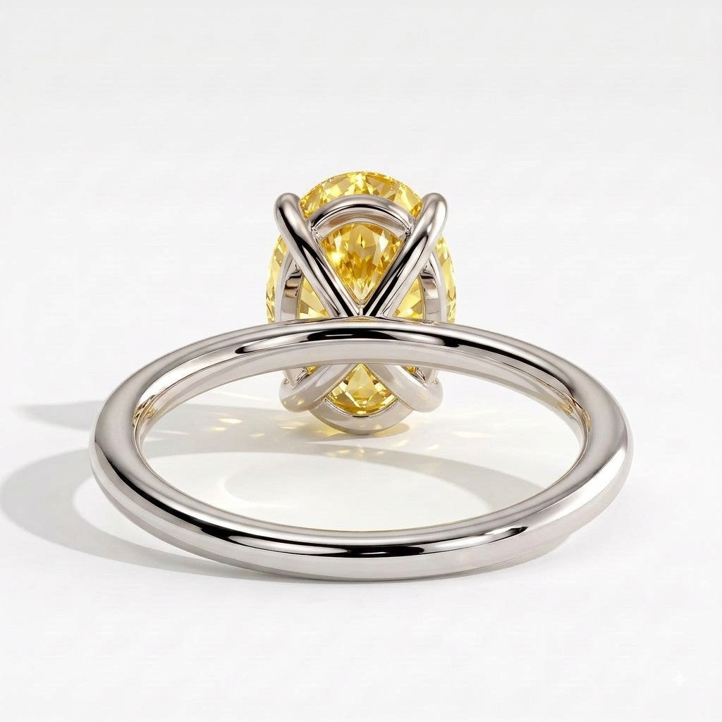 Fancy Vivid Yellow oval lab-grown diamond solitaire engagement ring in 14K (585) white gold, on white background 