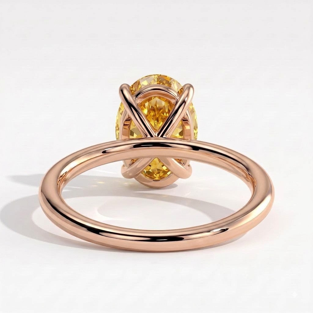 Fancy Vivid Yellow oval lab-grown diamond solitaire engagement ring in 18K (750) rose gold, on white background 