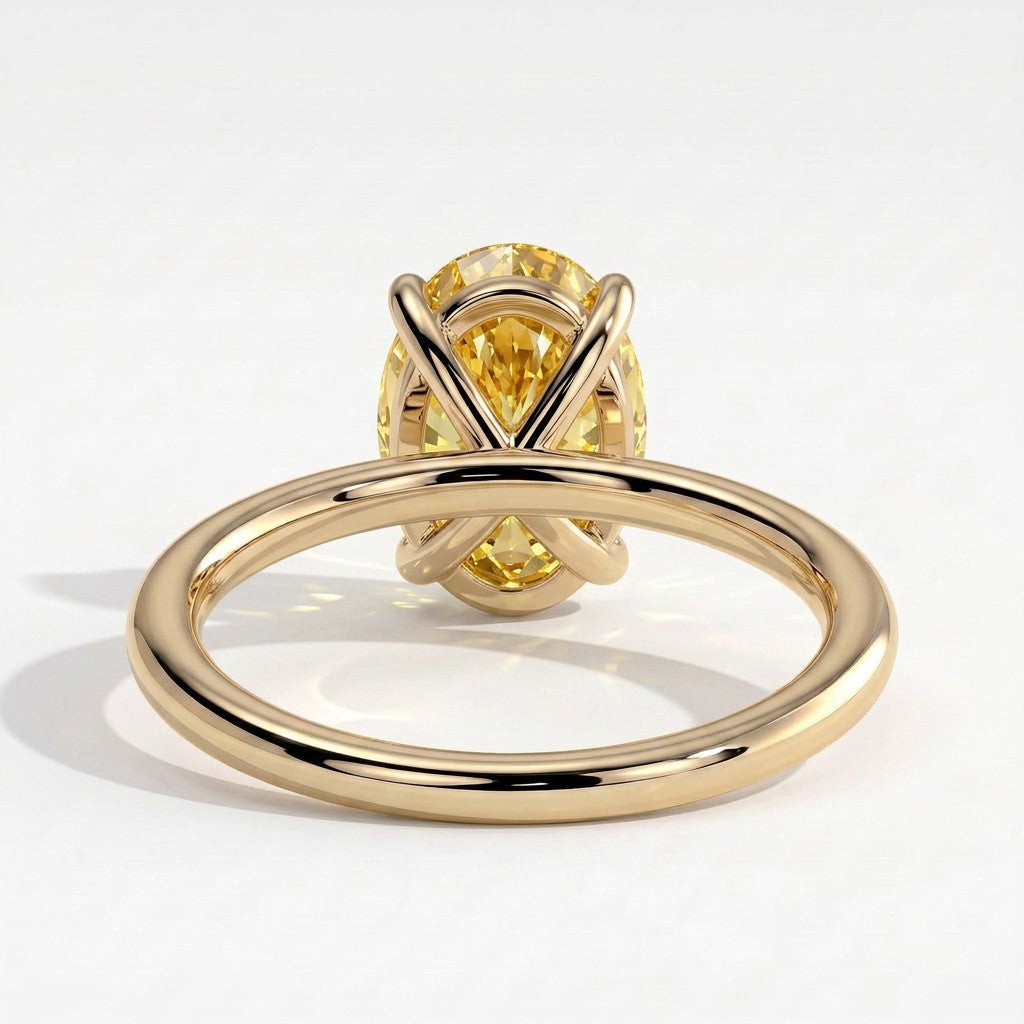 Fancy Vivid Yellow oval lab-grown diamond solitaire engagement ring in 18K (750) yellow gold, on white background 