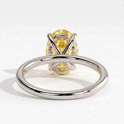 Fancy Vivid Yellow oval lab-grown diamond solitaire engagement ring in 950 platinum, on white background 