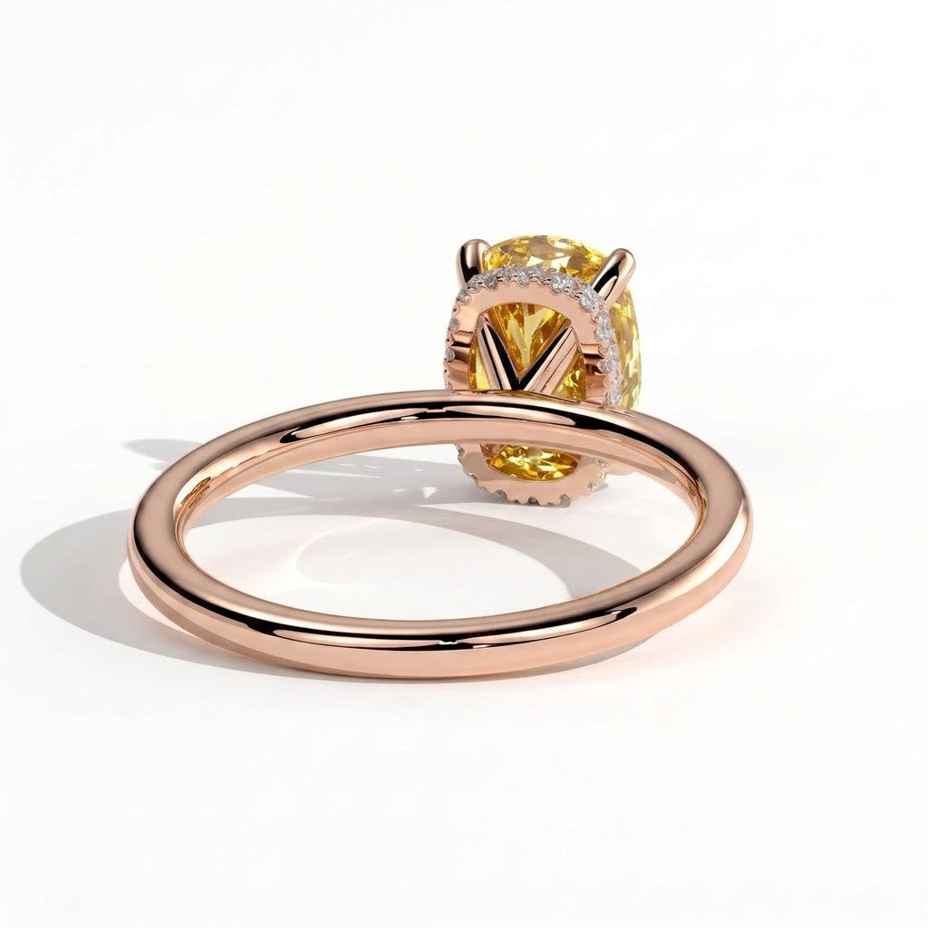 Fancy Vivid Yellow elongated cushion lab-grown diamond engagement ring with wrap-around hidden halo in 14K (585) rose gold, on white background 