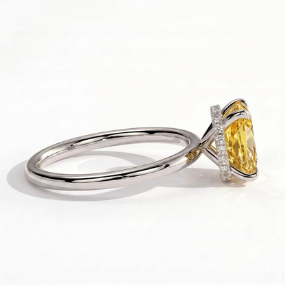 Fancy Vivid Yellow elongated cushion lab-grown diamond engagement ring with wrap-around hidden halo in 18K (750) white gold, detail view of the wrap-around hidden halo 
