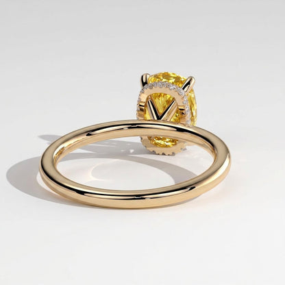 Fancy Vivid Yellow elongated cushion lab-grown diamond engagement ring with wrap-around hidden halo in 18K (750) yellow gold, on white background 