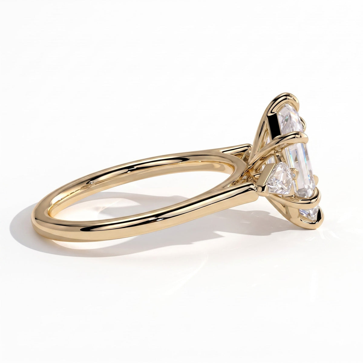 Elongated Hexagon lab-grown diamond three-stone engagement ring in 14K (585) yellow gold, detail view 